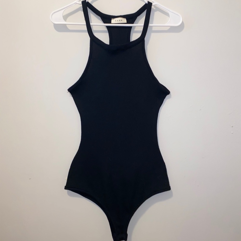 Waffle textured, body suit, dramatic open back.